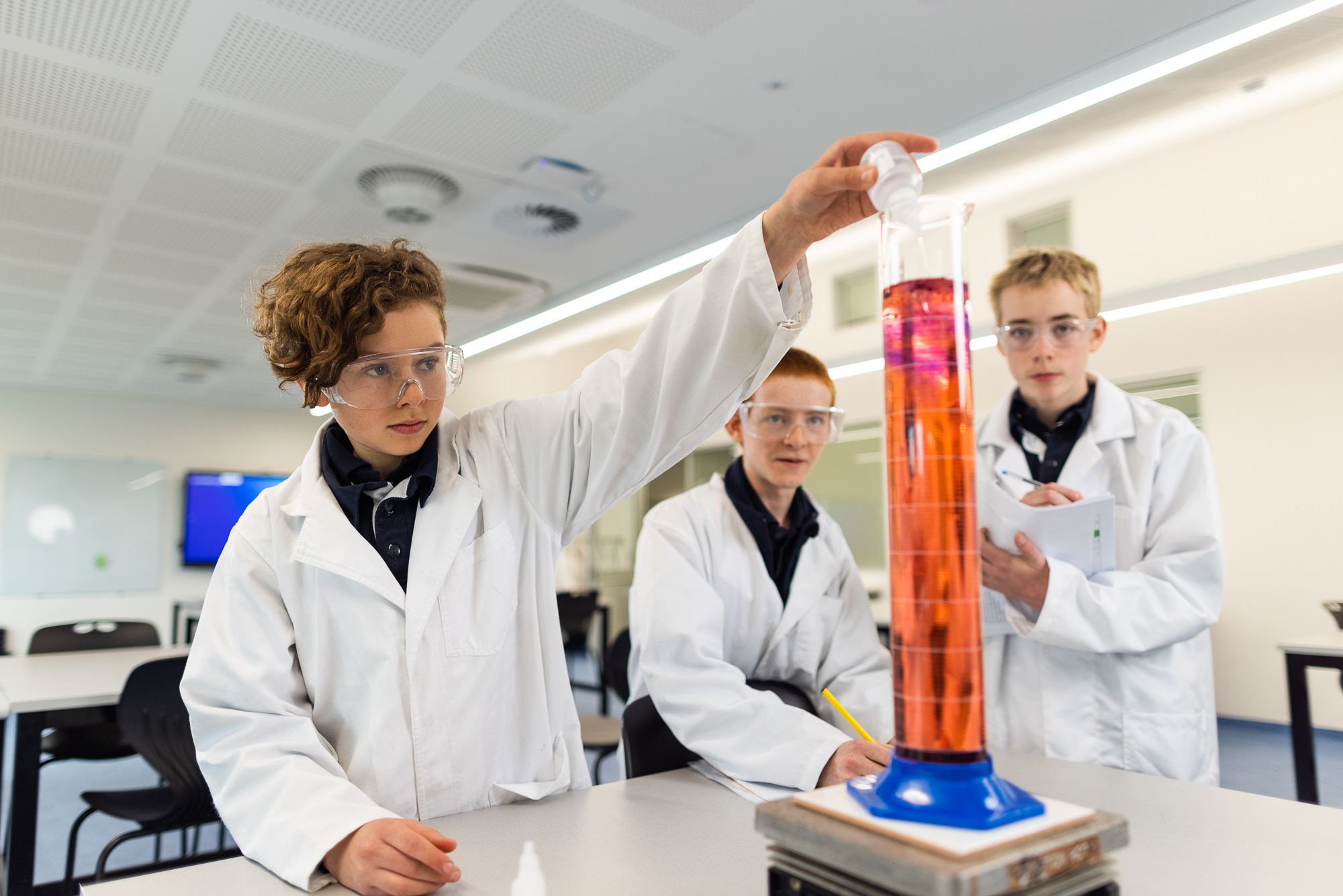 High school students conducting a science experiment