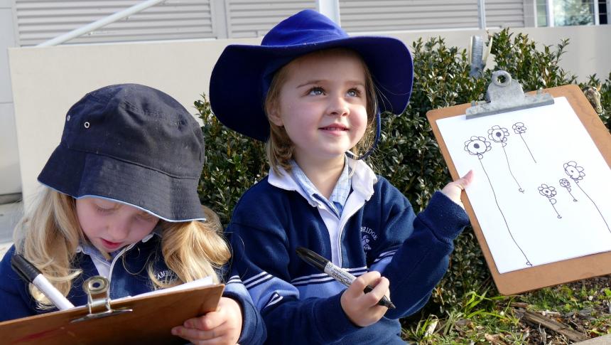 Children drawing outside